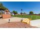 Fenced off-leash dog park area with pet waste station and grassy area at 17200 W Bell Rd # 1015, Surprise, AZ 85374