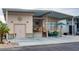 Inviting home featuring covered parking, a front porch, and desert landscaping, perfect for outdoor relaxation at 17200 W Bell Rd # 1015, Surprise, AZ 85374