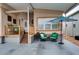 Inviting porch with comfortable seating and a vibrant blue umbrella at 17200 W Bell Rd # 1015, Surprise, AZ 85374
