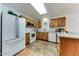 Functional kitchen featuring wood cabinets and bright lighting at 17200 W Bell Rd # 1015, Surprise, AZ 85374
