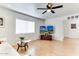 Spacious living area with a modern TV setup and comfortable seating at 17200 W Bell Rd # 1015, Surprise, AZ 85374