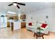 Bright living room with a view into the kitchen and stylish decor at 17200 W Bell Rd # 1015, Surprise, AZ 85374