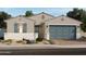 Charming single-story home featuring a two-car garage, inviting entryway, and low-maintenance landscaping at 17798 W Pierson St, Goodyear, AZ 85395