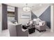 Stylish living room with a modern color scheme, comfortable seating, and contemporary decor at 18247 W Soft Wind Dr, Surprise, AZ 85387