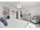 A spacious main bedroom boasts a sitting area, en-suite bathroom, and walk-in closet at 18247 W Soft Wind Dr, Surprise, AZ 85387
