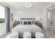 Comfortable main bedroom with a large bed, accent wall, and bedside tables at 18247 W Soft Wind Dr, Surprise, AZ 85387