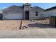 New construction home featuring a two-car garage, neutral colors, and contemporary design elements at 18795 E Bruno Dr, Gold Canyon, AZ 85118