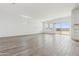 Bright and airy living room featuring tile flooring, a sliding glass door to backyard, and neutral walls at 18795 E Bruno Dr, Gold Canyon, AZ 85118
