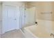 Bathroom featuring a walk in shower, large bathtub, and a neutral color palette at 20750 N 87Th St # 2062, Scottsdale, AZ 85255