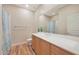 Well lit bathroom with wood floors, spacious vanity, and a large mirror at 20750 N 87Th St # 2062, Scottsdale, AZ 85255