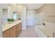 Spacious bathroom featuring double vanity, a bathtub and a glass enclosed shower at 20750 N 87Th St # 2062, Scottsdale, AZ 85255
