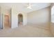 Spacious bedroom with neutral walls, carpet and a glimpse into the en-suite bathroom at 20750 N 87Th St # 2062, Scottsdale, AZ 85255