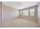 A bright bedroom featuring neutral walls, carpet and three windows offering natural light at 20750 N 87Th St # 2062, Scottsdale, AZ 85255