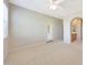 Large bedroom featuring neutral walls, carpet, access to the patio and a glimpse into the bathroom at 20750 N 87Th St # 2062, Scottsdale, AZ 85255