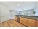 Kitchen with wood cabinets and an island looking into the living area at 20750 N 87Th St # 2062, Scottsdale, AZ 85255