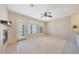 Open living room with fireplace, ceiling fan, and access to the balcony at 20750 N 87Th St # 2062, Scottsdale, AZ 85255