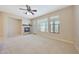 Spacious living room with fireplace, ceiling fan, and natural light at 20750 N 87Th St # 2062, Scottsdale, AZ 85255