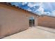 Balcony of a home with stucco walls and sliding doors, with a view of a neighboring house at 22074 W Papago St, Buckeye, AZ 85326