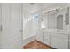 Bright bathroom with double vanity, tiled floor, and a shower-tub combination at 22074 W Papago St, Buckeye, AZ 85326