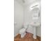 Powder room with pedestal sink, tile flooring, and a comfort height toilet at 22074 W Papago St, Buckeye, AZ 85326