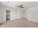 Bedroom with carpet, ceiling fan, and closet at 22074 W Papago St, Buckeye, AZ 85326
