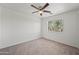 Bedroom with carpet, ceiling fan, and window at 22074 W Papago St, Buckeye, AZ 85326