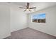 Well-lit bedroom features a ceiling fan and a window offering a glimpse of the outdoors at 22074 W Papago St, Buckeye, AZ 85326