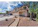 Inviting two-story home featuring a covered entry, two-car garage, and well-kept yard at 22074 W Papago St, Buckeye, AZ 85326