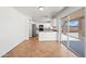 The eat-in kitchen has stainless steel appliances, sliding glass doors to backyard, and neutral countertops at 22074 W Papago St, Buckeye, AZ 85326