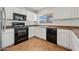 Modern kitchen with stainless steel appliances, and stylish tile flooring for easy maintenance at 22074 W Papago St, Buckeye, AZ 85326