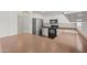 Kitchen featuring stainless steel refrigerator, microwave, oven, and generous counter space for cooking at 22074 W Papago St, Buckeye, AZ 85326