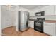 Modern kitchen featuring stainless steel appliances and white cabinets for ample storage and style at 22074 W Papago St, Buckeye, AZ 85326