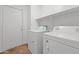 Laundry room with tiled floor and side-by-side washer and dryer hookups at 22074 W Papago St, Buckeye, AZ 85326