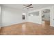 Bright living room with tile floors, ceiling fan, and an open layout at 22074 W Papago St, Buckeye, AZ 85326