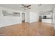 Bright living room featuring neutral walls, ceiling fan, and tile flooring, perfect for entertaining at 22074 W Papago St, Buckeye, AZ 85326