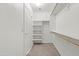Spacious walk-in closet with shelving and racks at 22074 W Papago St, Buckeye, AZ 85326