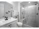 Stylish bathroom featuring a sleek vanity, modern fixtures, and a walk-in shower with glass door at 23018 E Mewes Rd, Queen Creek, AZ 85142