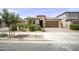 Beautiful single-Gathering home with manicured landscaping, a two-car garage, and a charming exterior at 23018 E Mewes Rd, Queen Creek, AZ 85142