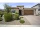Charming single-story home featuring a well-manicured front yard and attached two-car garage at 23018 E Mewes Rd, Queen Creek, AZ 85142