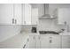 White cabinets, quartz countertops, stainless steel appliances in a modern kitchen at 23018 E Mewes Rd, Queen Creek, AZ 85142