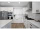 Beautiful kitchen with white cabinets, modern appliances, and quartz countertops at 23018 E Mewes Rd, Queen Creek, AZ 85142