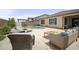 Inviting backyard oasis featuring a sparkling pool and stylish outdoor seating area for relaxation and entertainment at 23018 E Mewes Rd, Queen Creek, AZ 85142