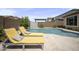 Resort-style backyard with a beautiful private pool and comfortable lounge chairs at 23018 E Mewes Rd, Queen Creek, AZ 85142
