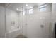 Luxurious walk-in shower features sleek subway tiles, a built-in bench, and dual shower heads at 23018 E Mewes Rd, Queen Creek, AZ 85142