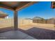 This backyard has a brick patio and a block fence at 24627 W Ripple Rd, Buckeye, AZ 85326