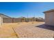 This backyard has a brick patio, block fence and landscaping at 24627 W Ripple Rd, Buckeye, AZ 85326