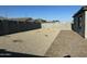 This backyard features a gravel area, offering a private and low-maintenance outdoor space perfect for relaxing or entertaining at 24627 W Ripple Rd, Buckeye, AZ 85326