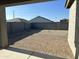 This backyard features a brick patio, offering a private and low-maintenance outdoor space perfect for relaxing or entertaining at 24627 W Ripple Rd, Buckeye, AZ 85326