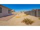 Backyard with gravel, small patio, and minimal desert landscaping at 24627 W Ripple Rd, Buckeye, AZ 85326