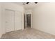Bedroom with a closet and view into the hall at 24627 W Ripple Rd, Buckeye, AZ 85326